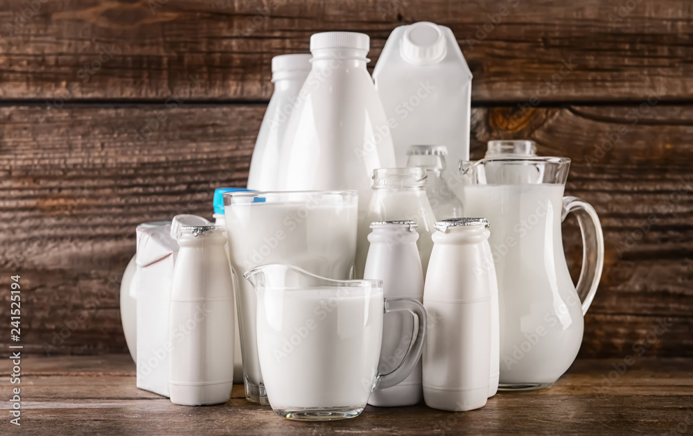 Different milk products on wooden table