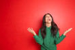 Screaming young woman on color background