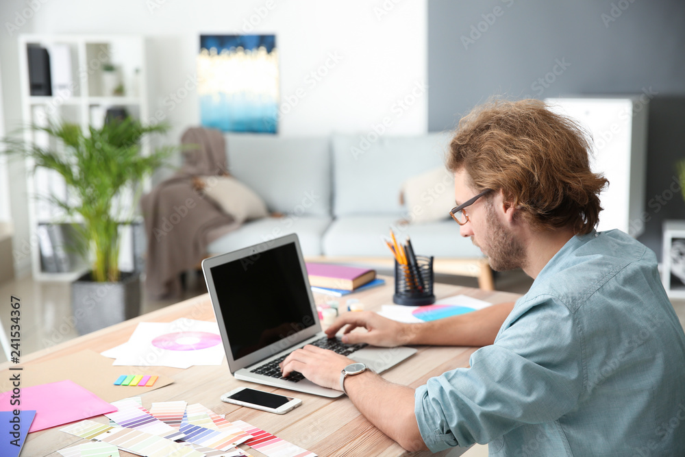 Young designer working in studio
