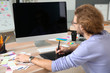 © Pixel-Shot - Young designer working in studio