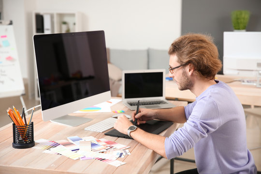 Young designer working in studio