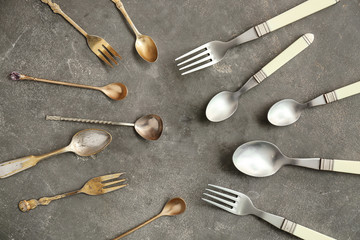 Set of cutlery on grey background