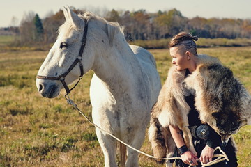 Poster - Viking woman with axe in a traditional warrior clothes