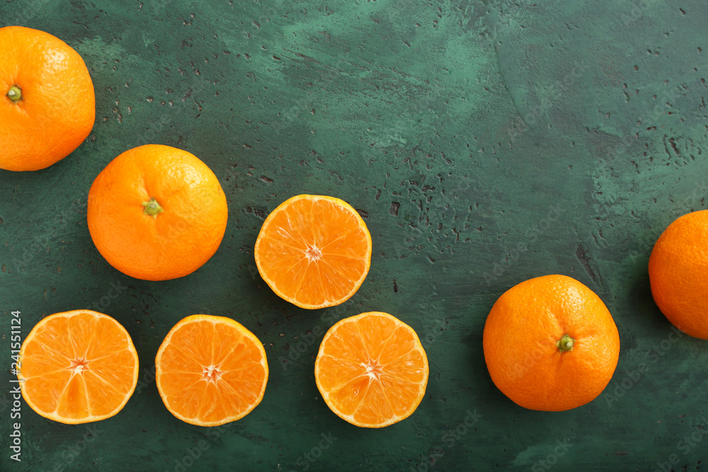 Tasty tangerines on color background