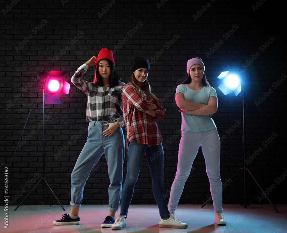 Team of young dancers in club