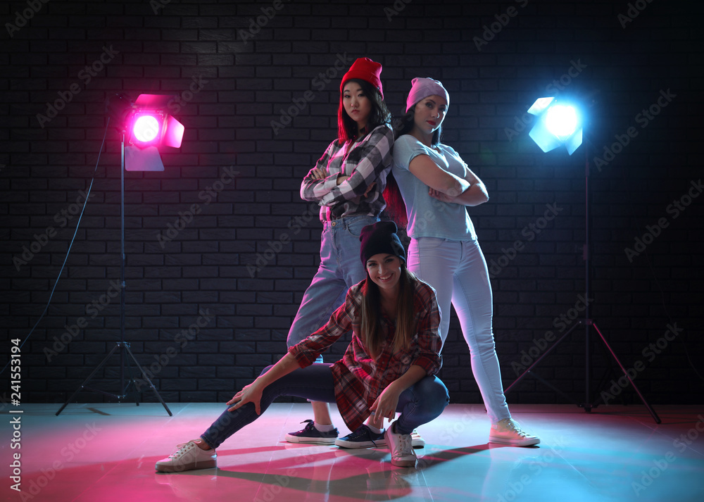 Team of young dancers in club