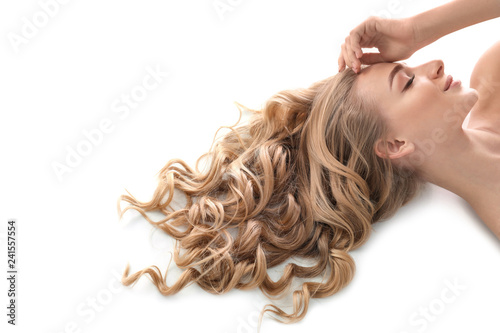 Fotografía Young woman with beautiful curly hair on white background