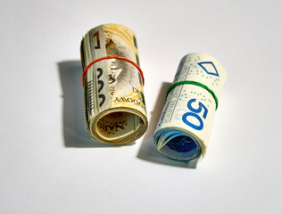 Rolled up polish money (PLN) - two hundred and fifty polish zloty bills isolated on a white background