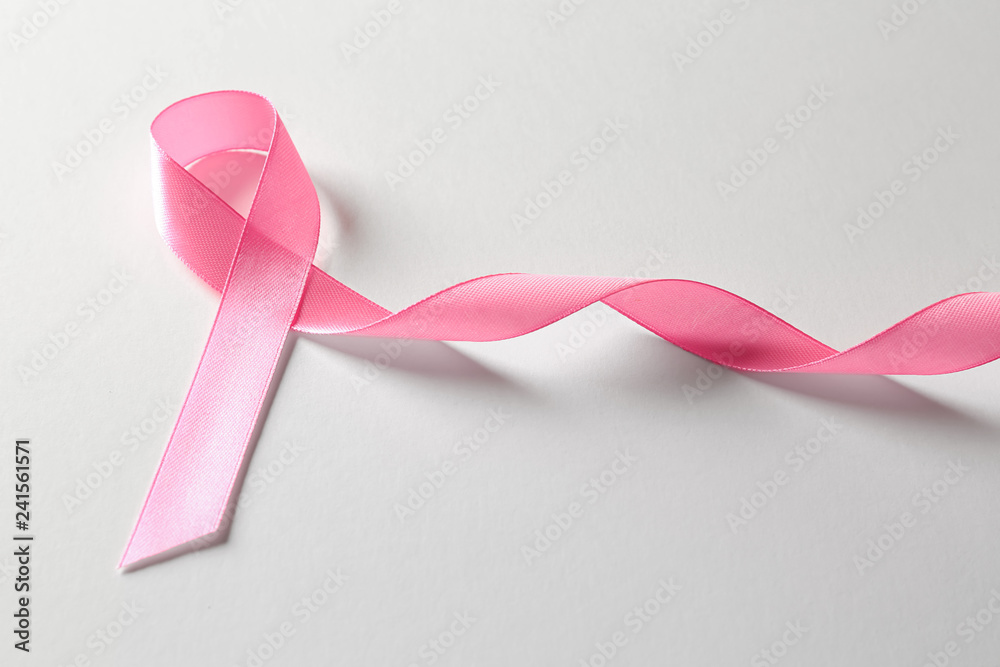 Pink ribbon on white background. Breast cancer awareness concept