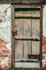 Wall Mural - Old weathered grunge farm abandoned shed door closeup