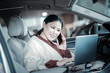 © Viacheslav Yakobchuk - Pleasant smiling businesswoman calling her children on way home