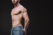 © LIGHTFIELD STUDIOS - cropped view of sexy shirtless macho posing isolated on black