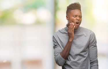 Sticker - Young african american man over isolated background touching mouth with hand with painful expression because of toothache or dental illness on teeth. Dentist concept.