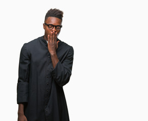 Poster - Young african american priest man over isolated background bored yawning tired covering mouth with hand. Restless and sleepiness.