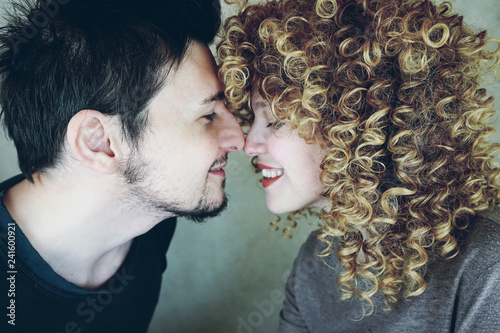 Portrait Of A Natural Caucasian Couple Of Young Woman With Curly