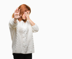 Canvas Print - Young beautiful woman over isolated background wearing winter sweater covering eyes with hands and doing stop gesture with sad and fear expression. Embarrassed and negative concept.