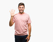© Krakenimages.com - Young handsome man over isolated background showing and pointing up with fingers number five while smiling confident and happy.