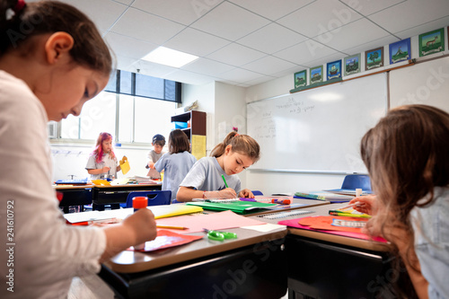 Children doing classwork in a classroom Stock 写真 | Adobe Stock