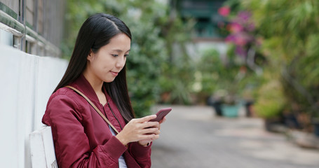 Sticker - Woman use of mobile phone in city