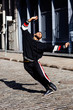 © Carlos David - Young man dancing in street