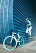 © Sergio - modern young guy with casual clothes, hat and glasses on bicycle