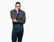 © Krakenimages.com - Young handsome man wearing glasses over isolated background looking stressed and nervous with hands on mouth biting nails. Anxiety problem.