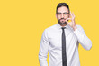 © Krakenimages.com - Young handsome business man wearing glasses over isolated background mouth and lips shut as zip with fingers. Secret and silent, taboo talking