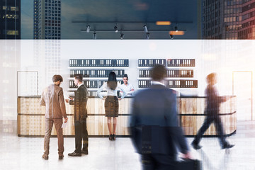 Wooden reception in white office, people