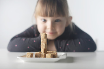 child, sugar cubes. the problem of excessive consumption of sugar by children under the age of 10 ye