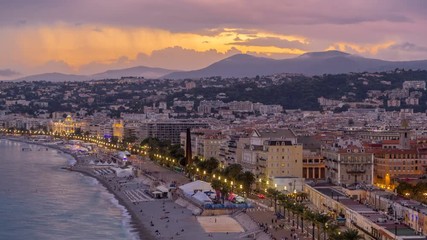 Wall Mural - Panorama over Nice city and Mediterranean Sea aerial day to night timelapse