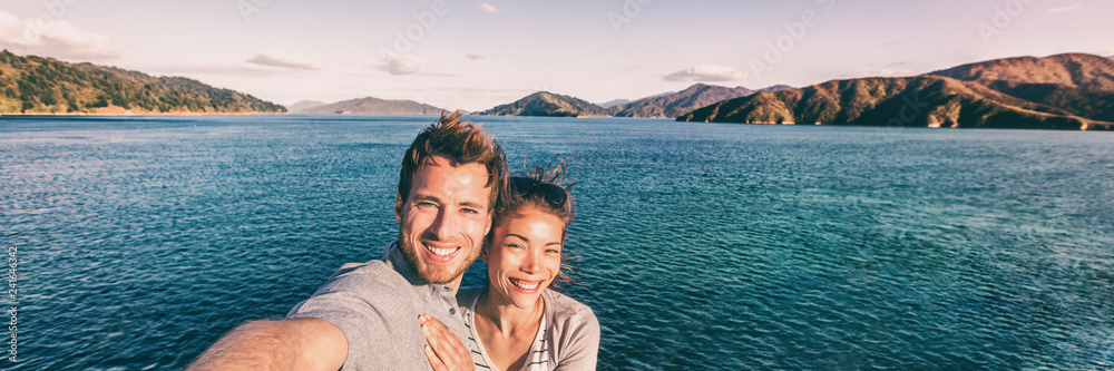 Cruise ship holiday travel vacation tourists taking selfie on summer holidays destination banner panorama .Interracial couple Asian woman tourist, Caucasian man smiling. - obrazy, fototapety, plakaty 