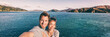 © Maridav - Cruise ship holiday travel vacation tourists taking selfie on summer holidays destination banner panorama .Interracial couple Asian woman tourist, Caucasian man smiling.