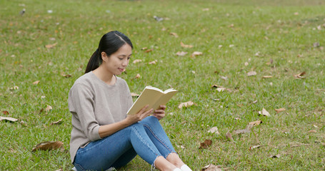 Sticker - Woman read book and sitting on green grass