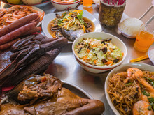 Food For Pray Respect To Predecessor In Chinese Culture And When Chinese New Year Coming.Boiled Duck,Steamed Fish,Fried Noodle With Shrimp On The Metal Table