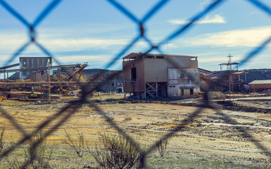 Complex of mine buildings of a old mining enterprise, inside the wire fence in Riotinto