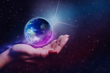 Leinwandbilder - Whole world in woman hands plam. Nebula dust in infinite space. Mixed media. 