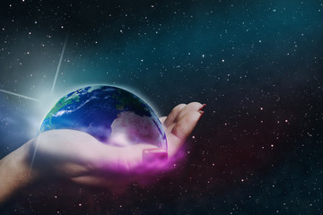 Leinwandbilder - Whole world in woman hands plam. Nebula dust in infinite space. Mixed media. 
