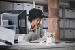 © ReeldealHD images - Female african american business executive working in an office looking at paperwork