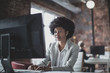© ReeldealHD images - Female african american business executive working in an office on a desktop computer
