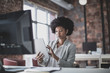 © ReeldealHD images - Female african american business executive working in an office on a digital tablet