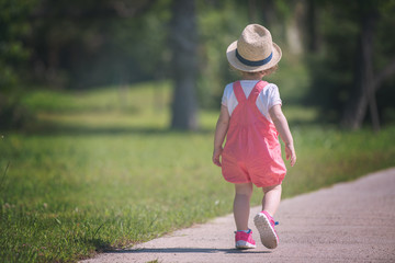 Sticker - little girl runing in the summer Park