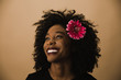 © TONL - Smiling woman standing against beige background