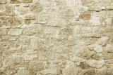 Fototapeta Góry - Old beige stone wall background texture
