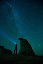 Zion National Park, Utah: A Person With A Headlamp Admires The Night Sky Near Checkerboard Mesa.