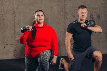 Young couple is working out at sport center. close up photo. motivation, active life, losing weight