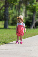 Sticker - little girl runing in the summer Park