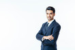 © Carlos David - Portrait of a confident smiling businessman with arms crossed