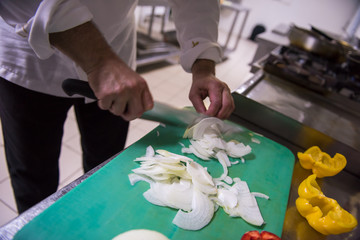 Wall Mural - Chef hands cutting fresh and delicious vegetables