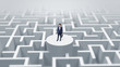 © ra2 studio - Businessman standing on the top a maze and looking through