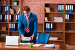 © Elnur - Young handsome employee sitting in the office